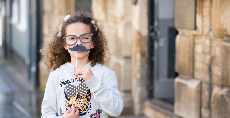 Girl with moustache mask