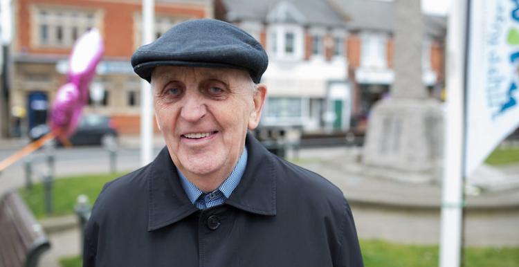 older man smiling at camera 