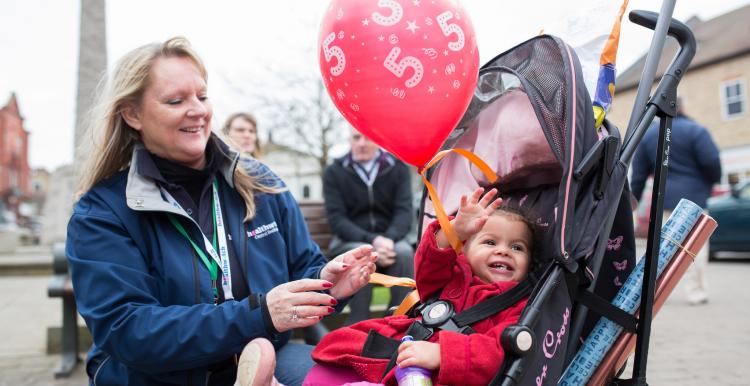 Woman and child in pushchair