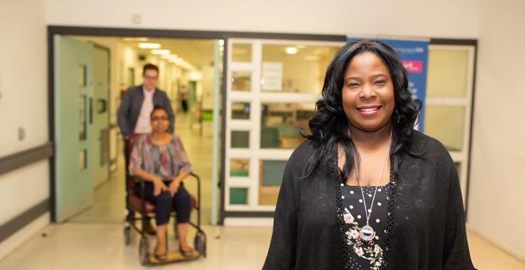 Women and background people in hospital