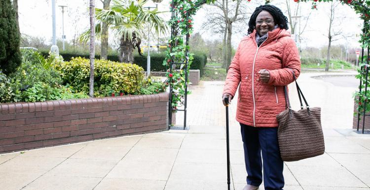 woman with walking stick